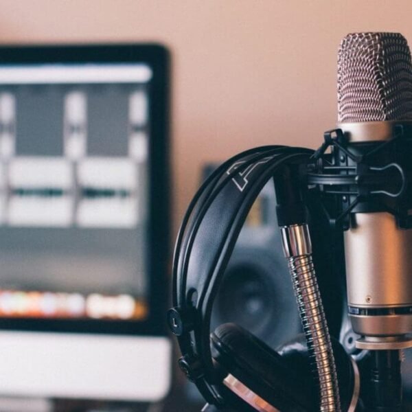 This image depicts a podcast recording and editing studio